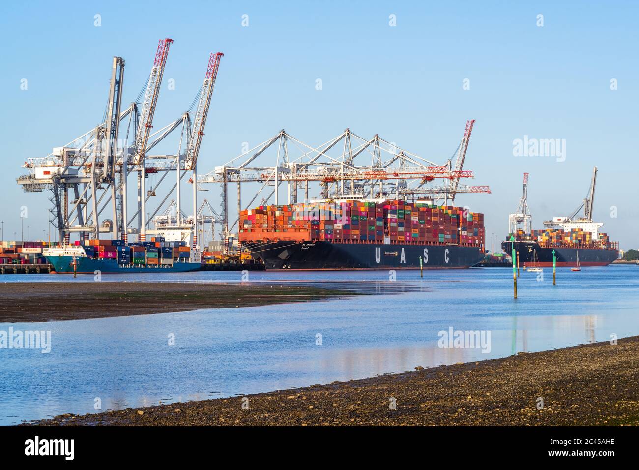 The UASC AL JASRAH Container Ship located at the Port of Southampton - as seen from Eling Waterfront, England, UK Stock Photo
