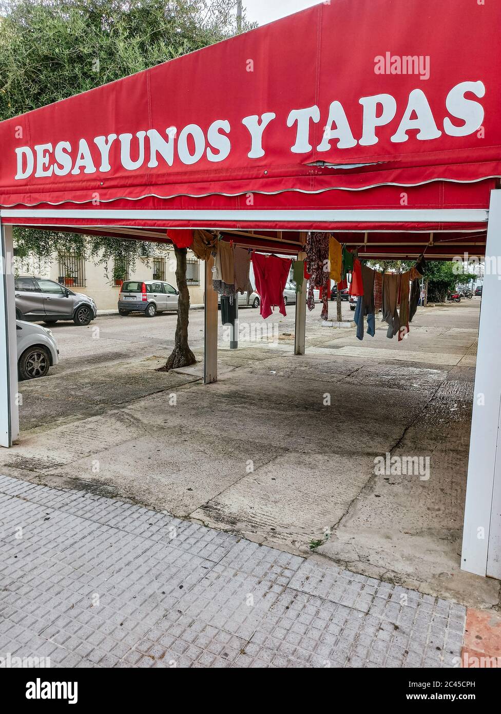 JEREZ DE LA FRONTERA, SPAIN - May 07, 2020: JEREZ DE LA FRONTERA, SPAIN - 05, 07, 2020: Clothes laid out on a terrace of a breakfast and tapas bar. An Stock Photo