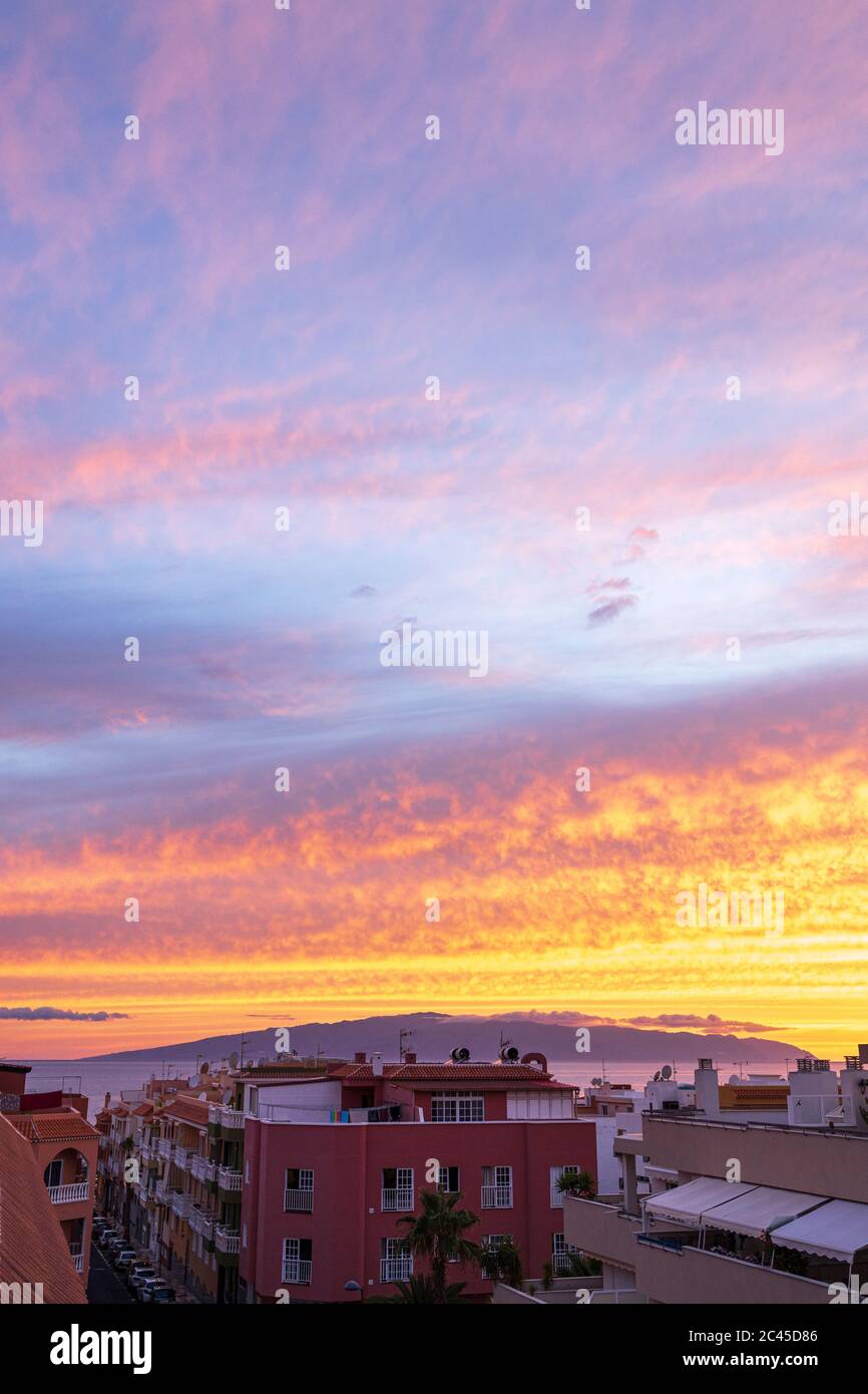 Vivid sunset over La Gomera from Playa San Juan, Tenerife, Canary Islands, Spain Stock Photo
