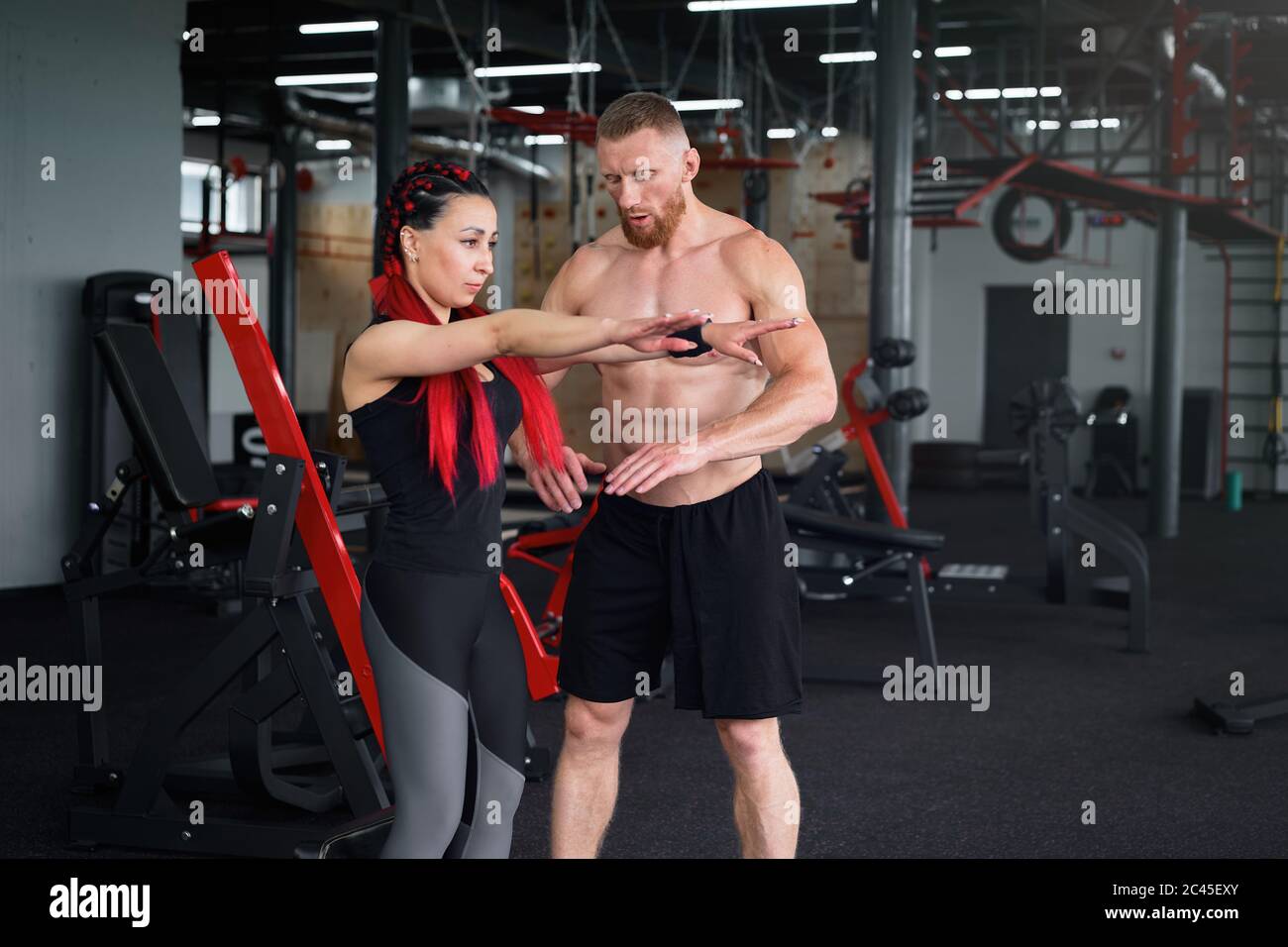 Personal trainer coach instructor athlete sportive man woman gym