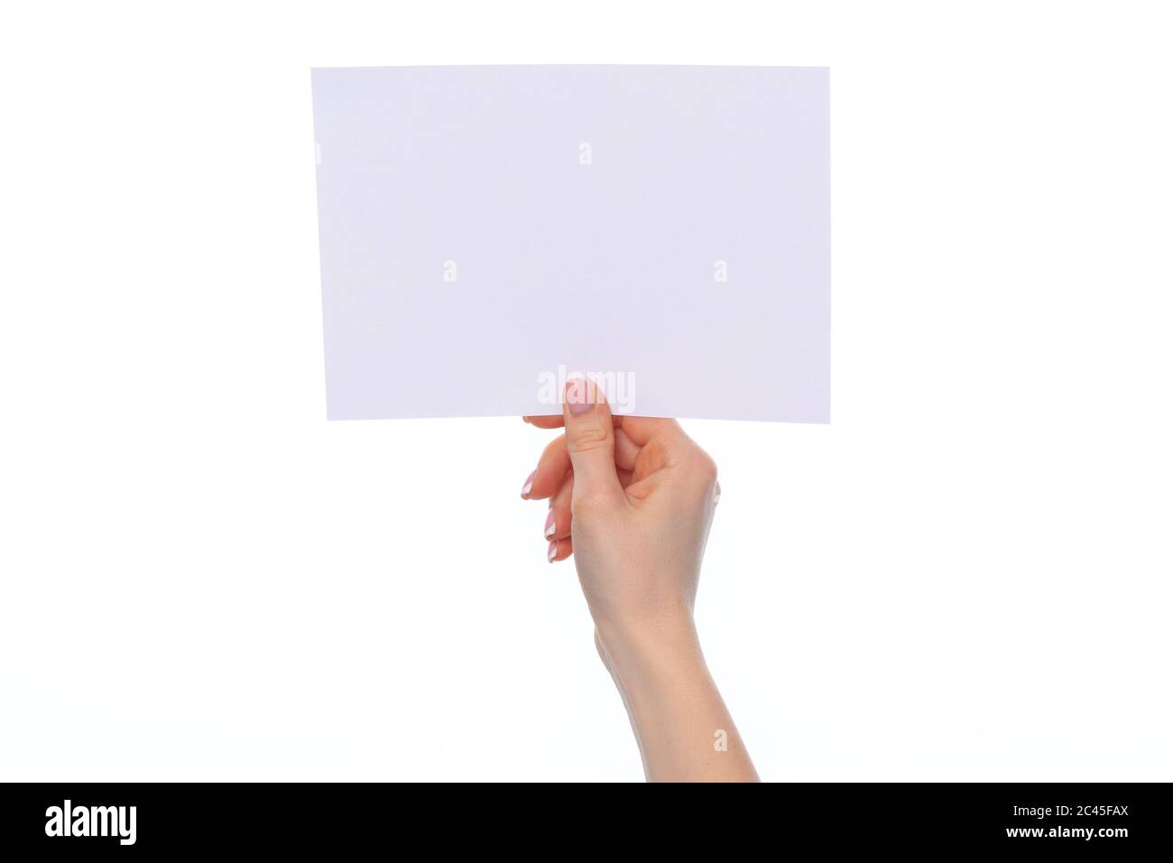 Female hand holding blank white sheet of paper isolated on white Stock ...