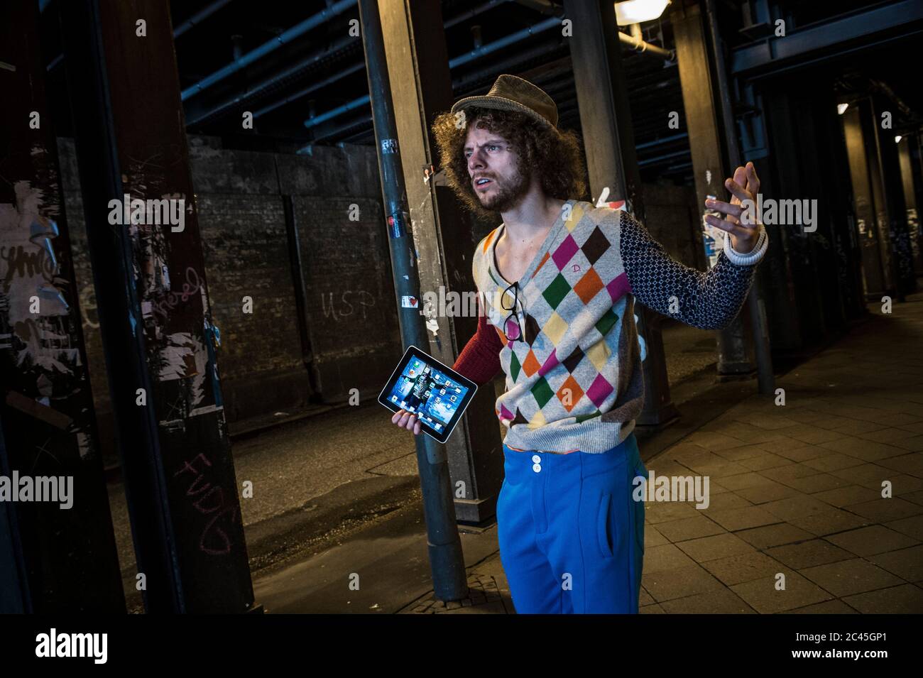 Man curly hair beard holds hi-res stock photography and images - Alamy