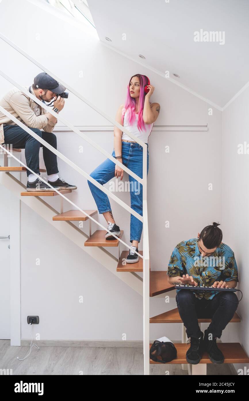 Group young gen friends sitting hi-res stock photography and images - Alamy