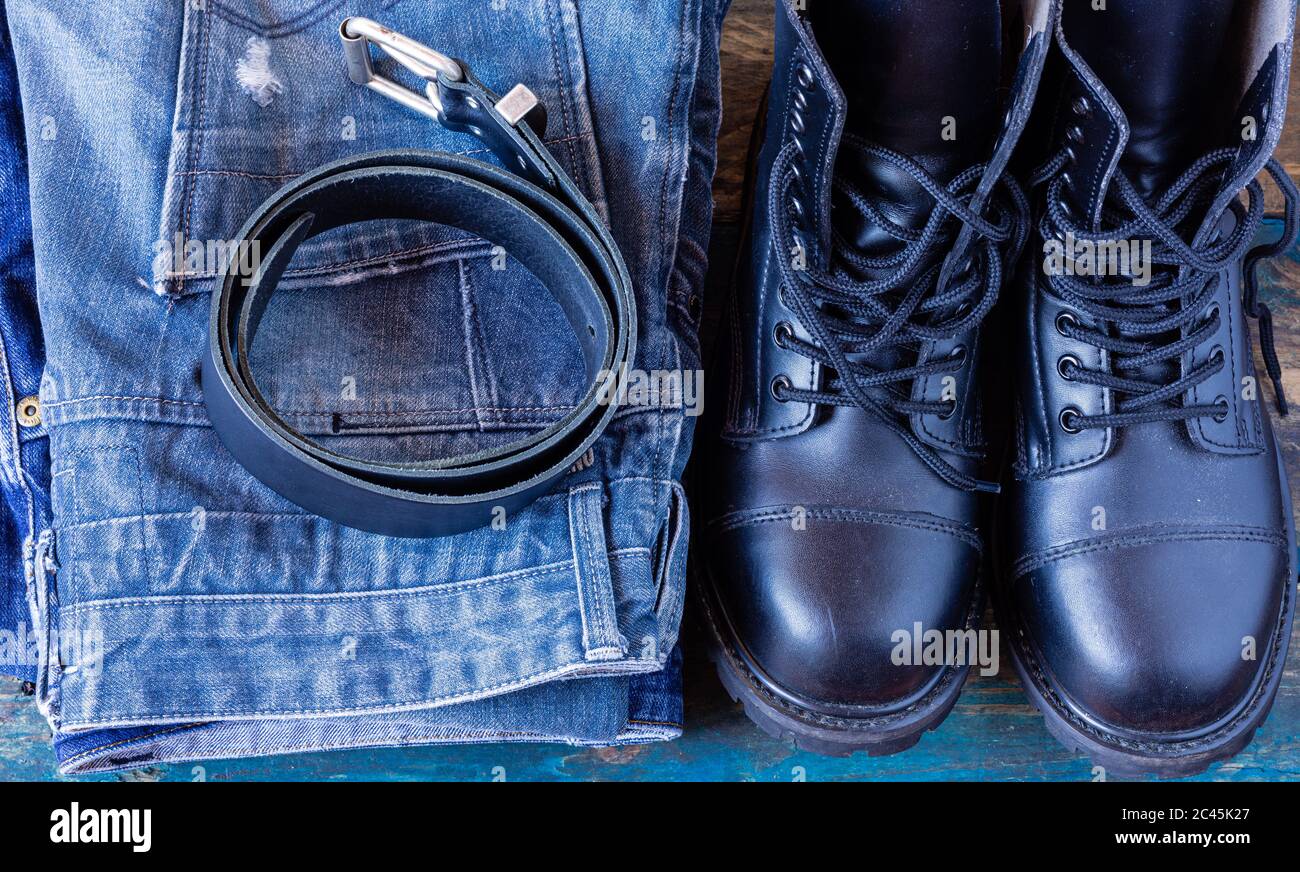 Blue jeans and work boots. Pants on old 