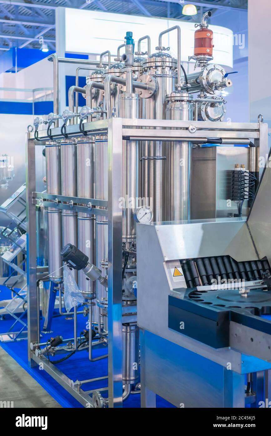 Pharmaceutical automatic production equipment at modern pharmacy factory or exhibition. Manufacturing, pharma industry, medicine and automated Stock Photo