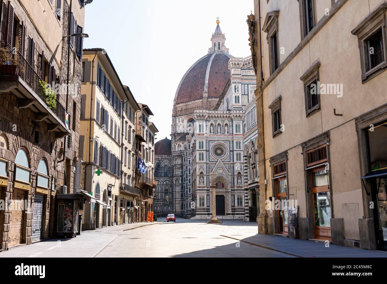View down an empty street towards the Duomo di Santa Maria del Fiore in Florence, Italy during the Corona virus crisis. Stock Photo
