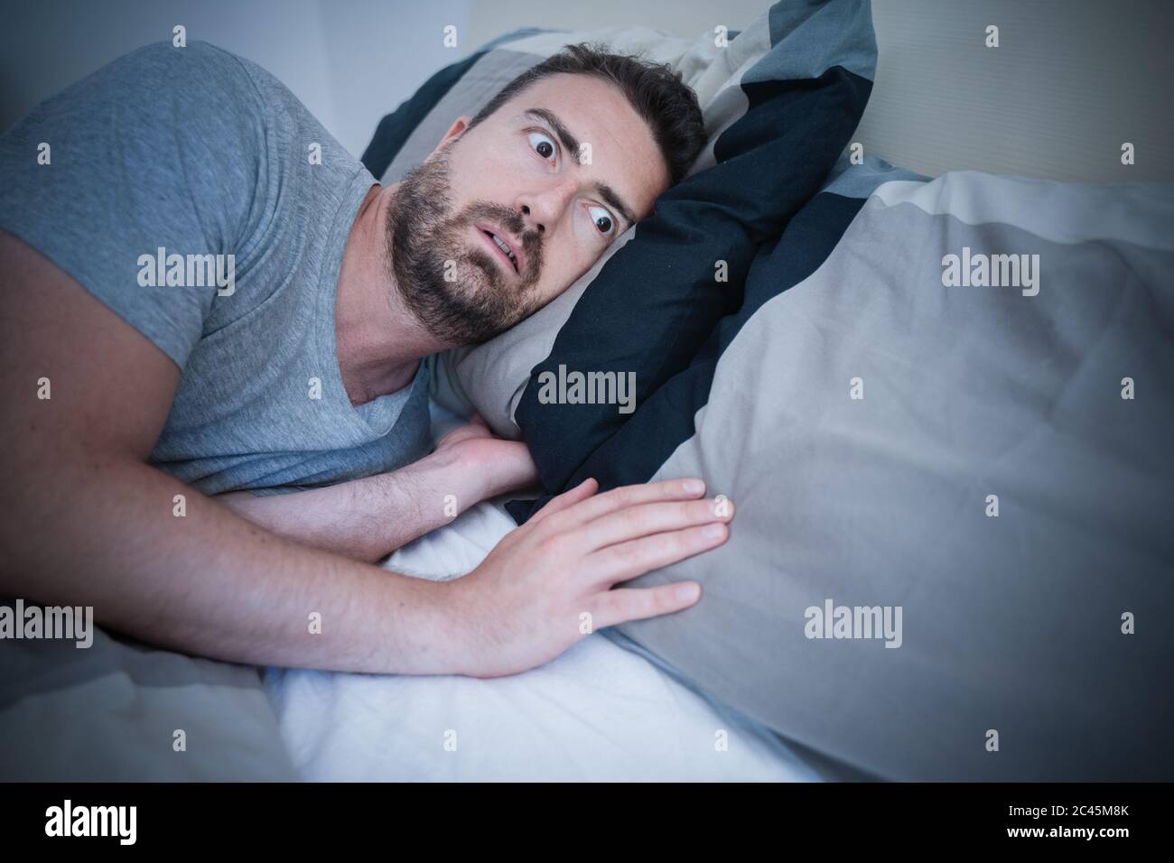 One man can't fall asleep in his bed Stock Photo Alamy