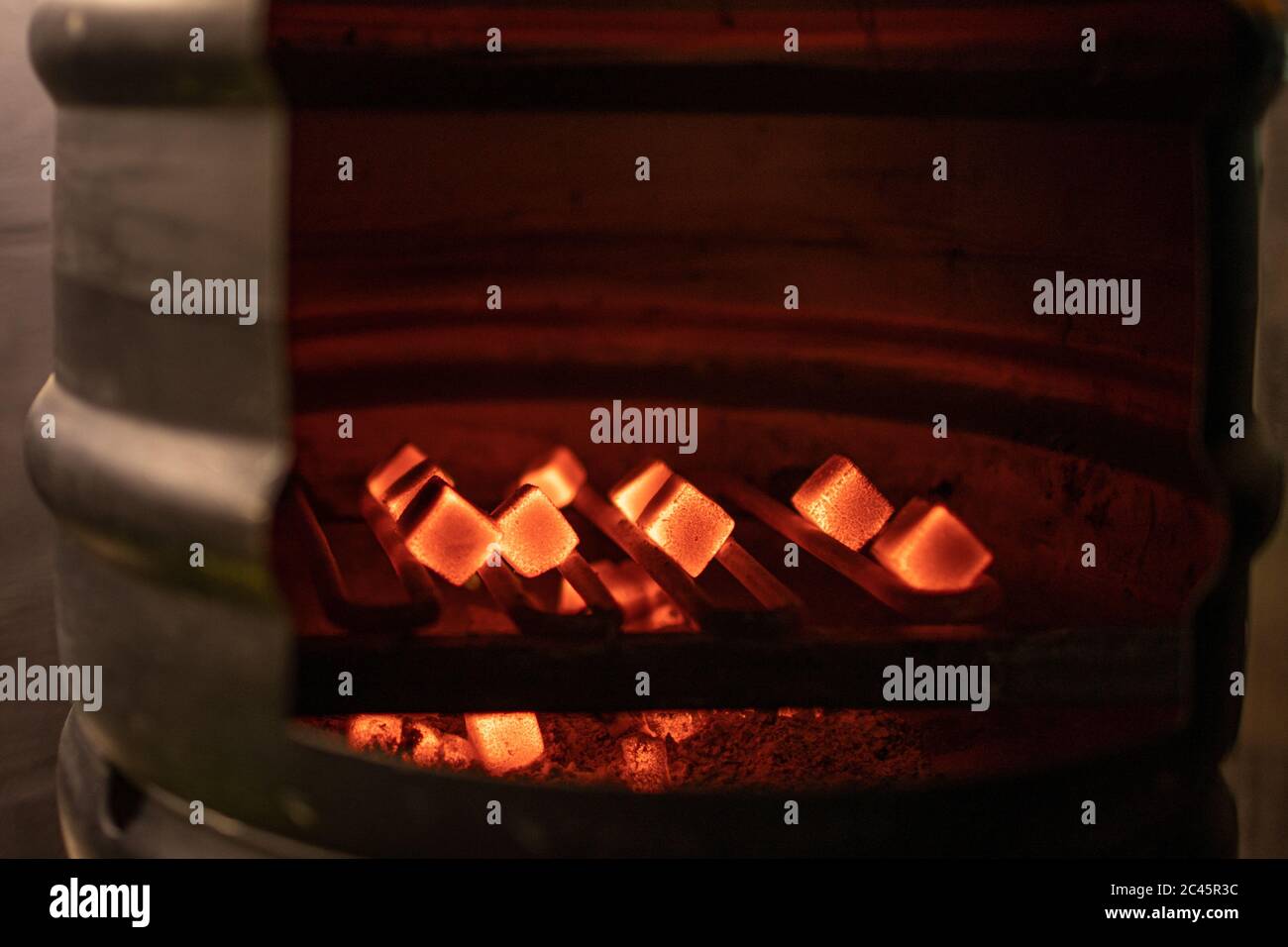 barbecue or hookah charcoals burning at metal barrel Stock Photo Alamy