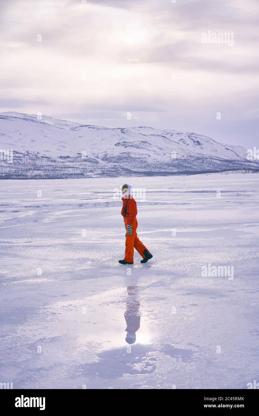 Boy standing on frozen lake in Vasterbottens Lan, Sweden. Stock Photo