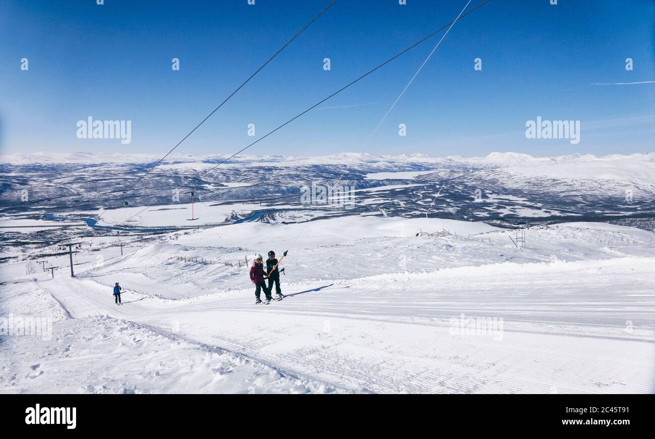 Skiers on a ski-lift in Vasterbottens Lan, Sweden. Stock Photo