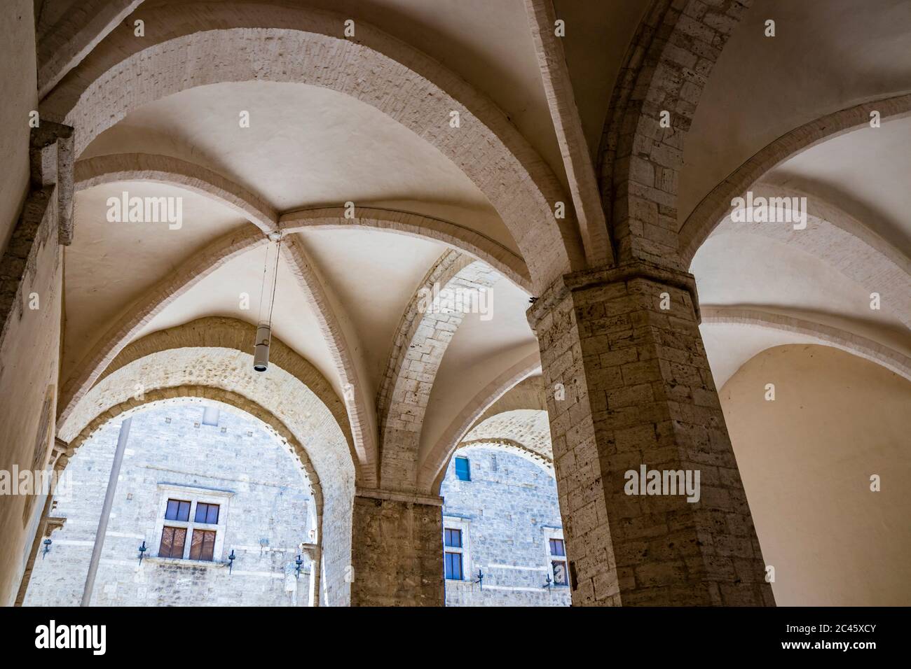 The Palazzo del Podestà, in Piazza dei Priori in the ancient medieval village of Narni. The porch with the cross vault. Umbria, Terni, Italy. Stock Photo