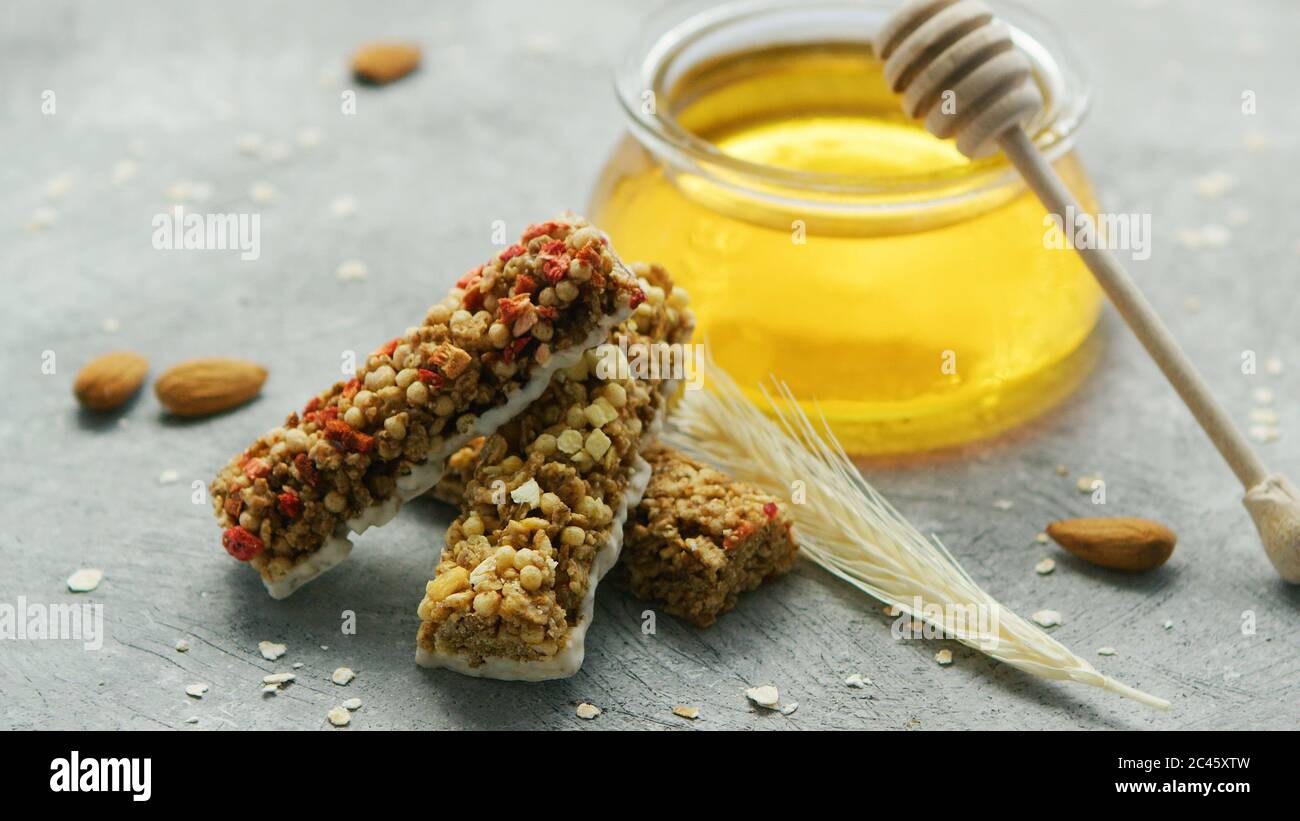 Jar of honey and oat bars Stock Photo