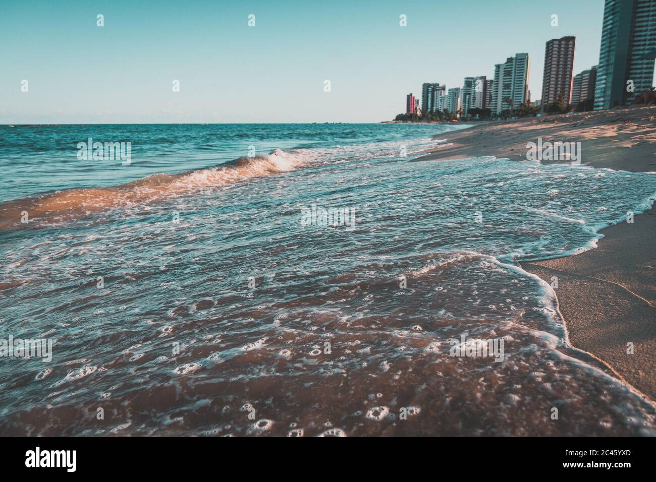 Beautiful scenery of the sea waves splashing on the beach in Ondas with ...