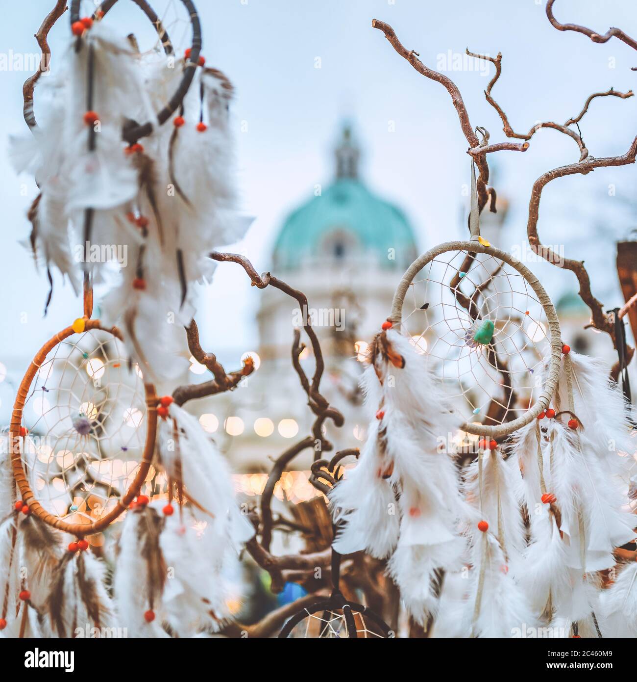 Set of dream catchers and St. Charles Church in Vienna with Christmas lights in the background Stock Photo