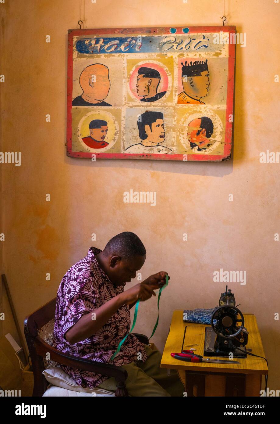 Taylor in a shop, Lamu county, Shela, Kenya Stock Photo