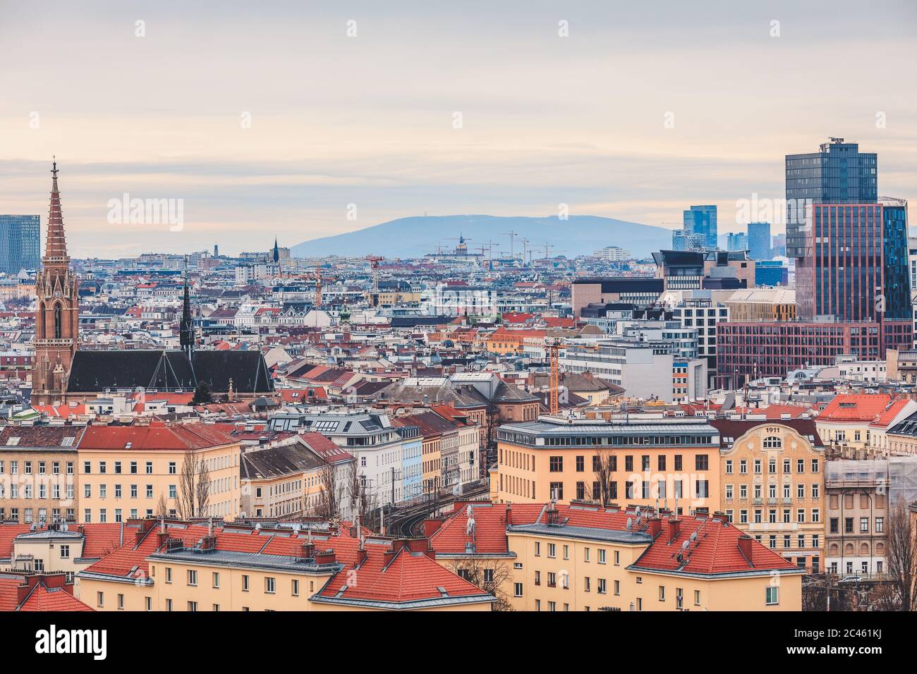 View from above over Vienna cityscape with mountain range in the background Stock Photo