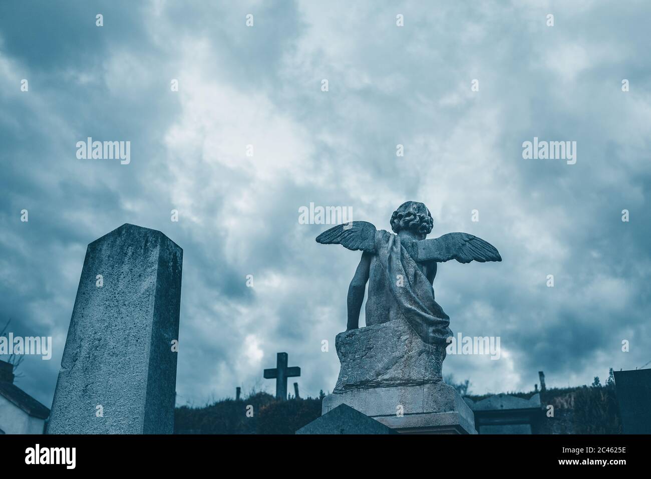Stone angel on cemetery Stock Photo