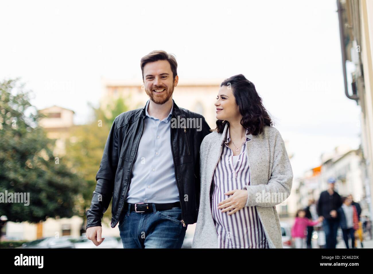 Pregnant couple walking, Florence, Italy Stock Photo