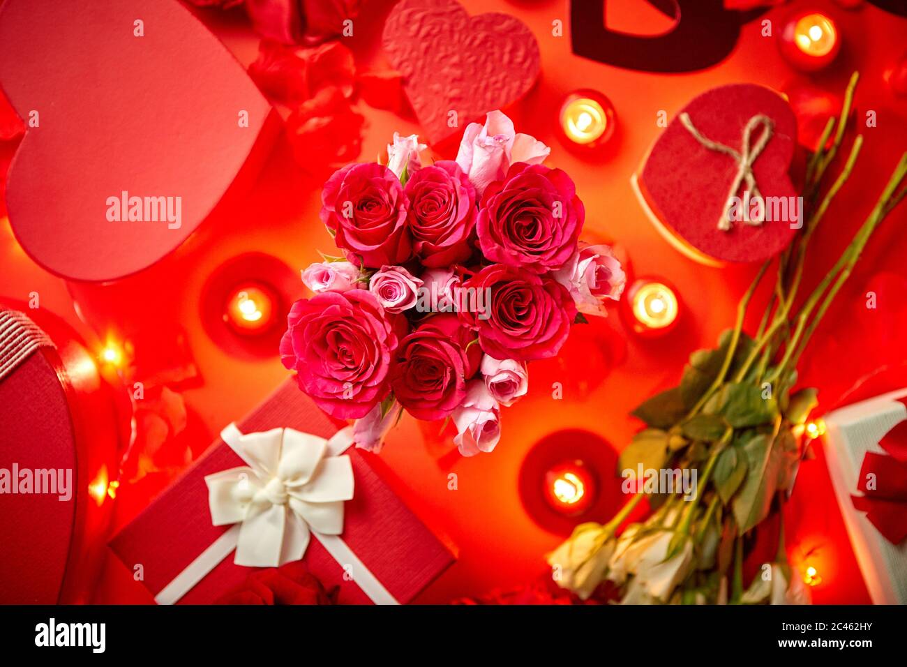 Valentines day romantic decoration with roses, boxed gifts, candles Stock Photo