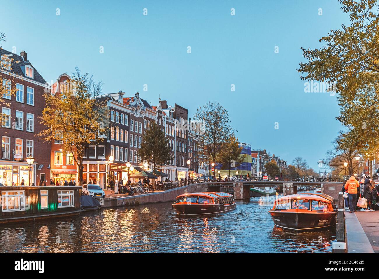 Canal of Amsterdam during blue hour in autumn time Stock Photo