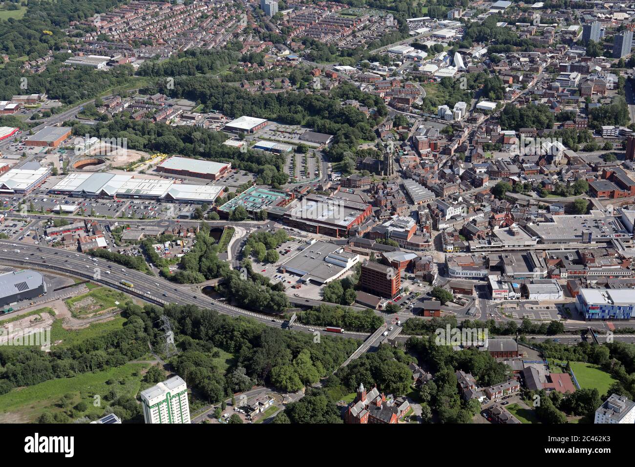 aerial view of Stockport town centre with the Sainsburys and Asda superstores in the middle of the shot Stock Photo