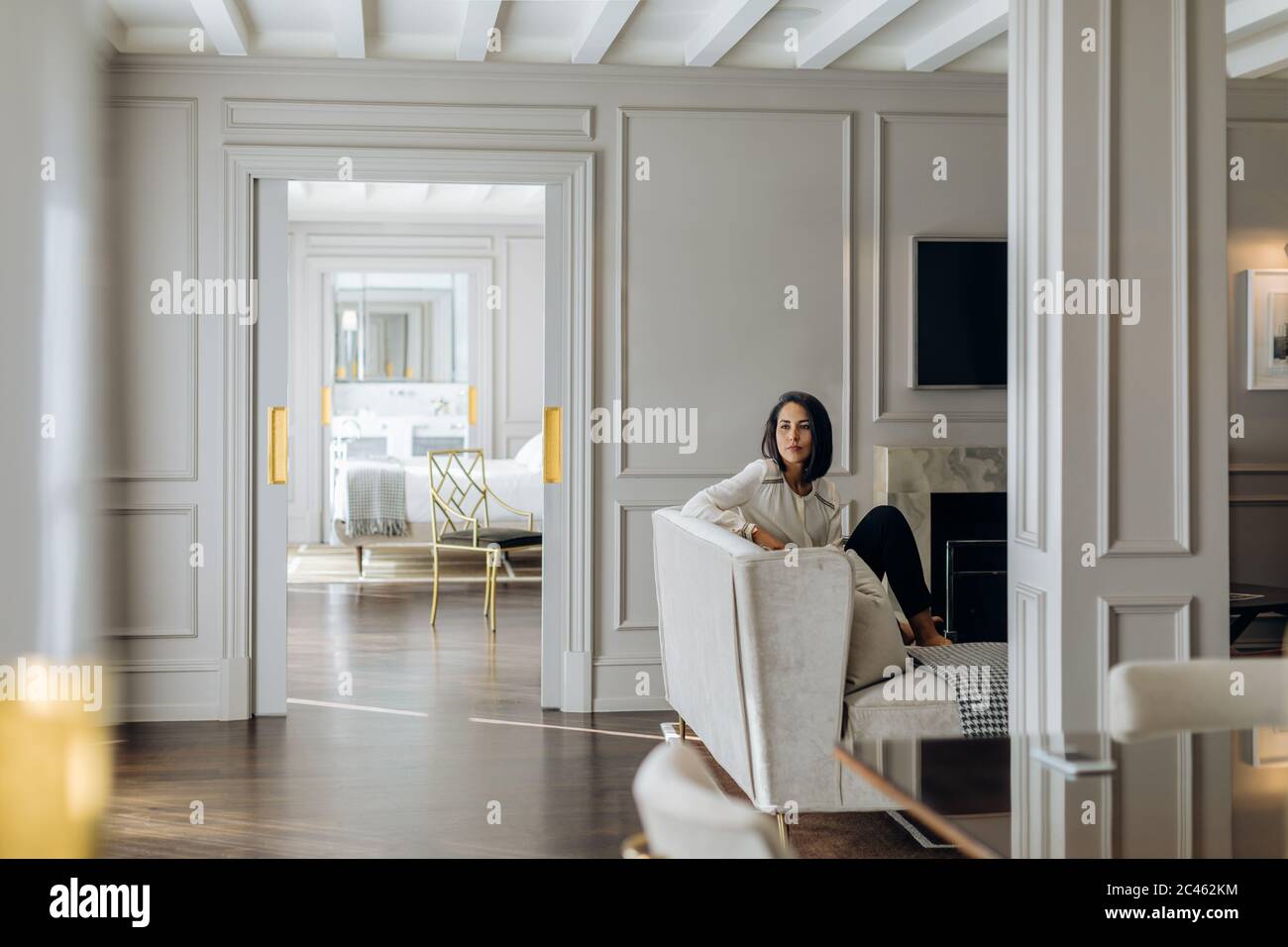 Businesswoman deep in thoughts in suite Stock Photo