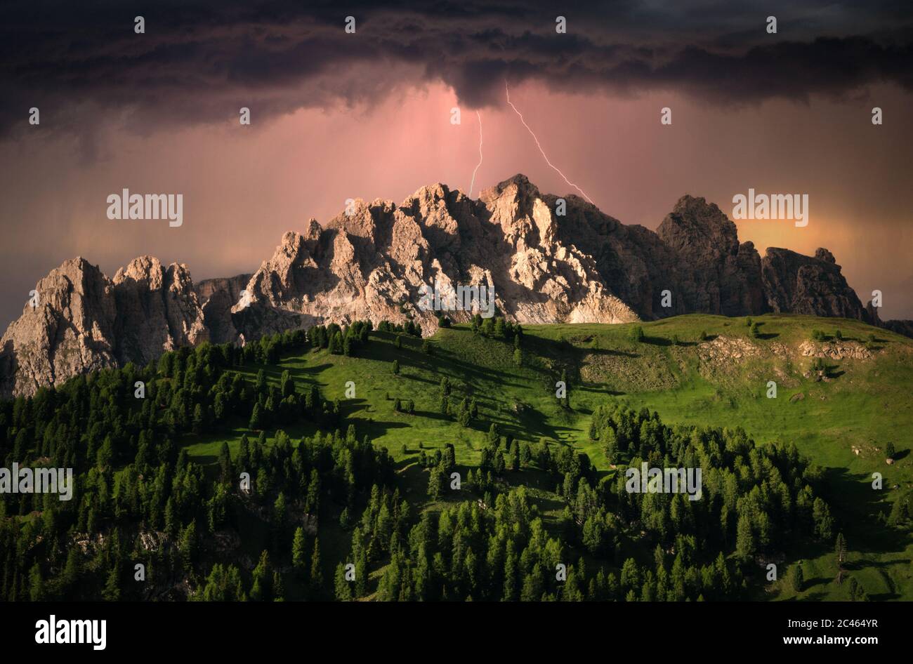 Dramatic clouds and lightning over mountain in Dolomite, Italy Stock Photo