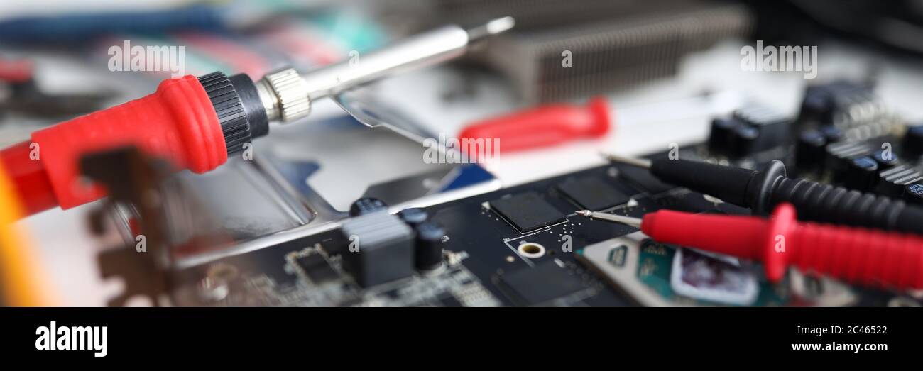 Close up on an electronic device are repair tools Stock Photo