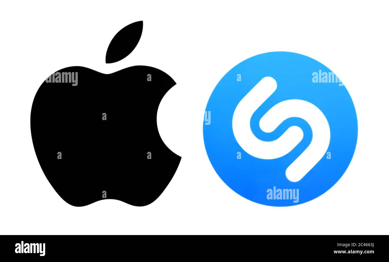Kiev, Ukraine - March 12, 2019: Popular brand logos printed on paper: Apple ios and Shazam. Apple confirms it has acquired Shazam Stock Photo