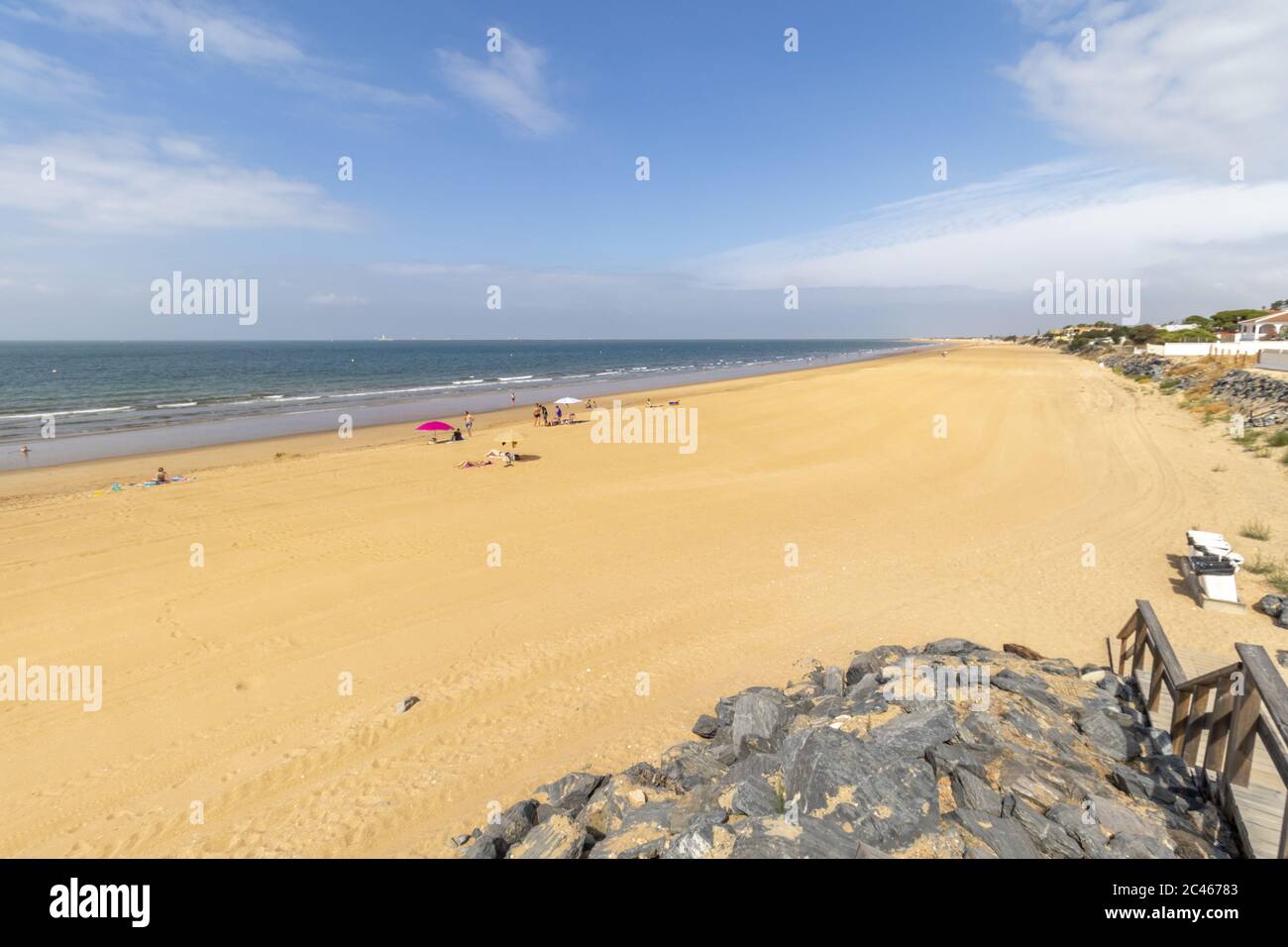 Sunny day on coastal beach hi-res stock photography and images - Alamy