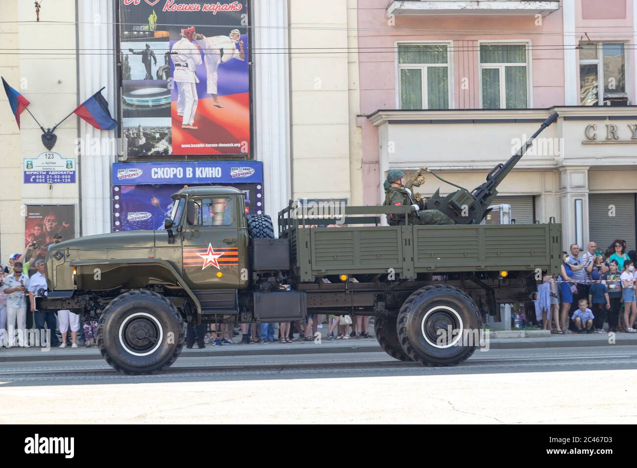 Donetsk, Donetsk People Republic, Ukraine, June 24, 2020: Soviet military trucks with anti-aircraft machine guns on board ride in the city center duri Stock Photo