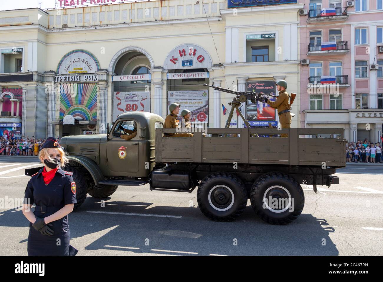 Donetsk, Donetsk People Republic - June 24, 2020: Soviet military trucks with heavy machine-guns and soldiers in oldstyle uniform on it moving on Arte Stock Photo