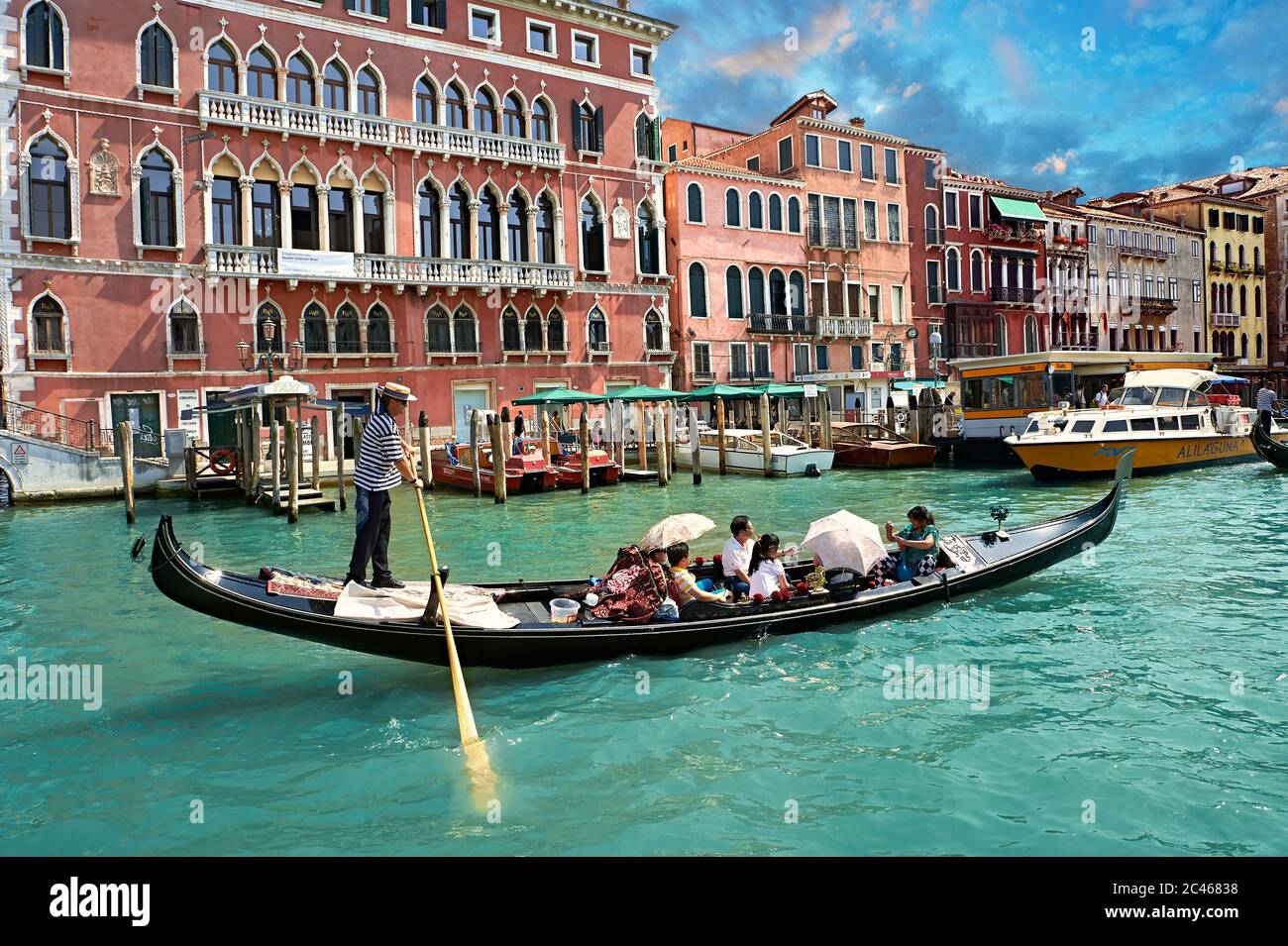 Venice gondola trip on the venetian grand canal at sunset Stock Photo