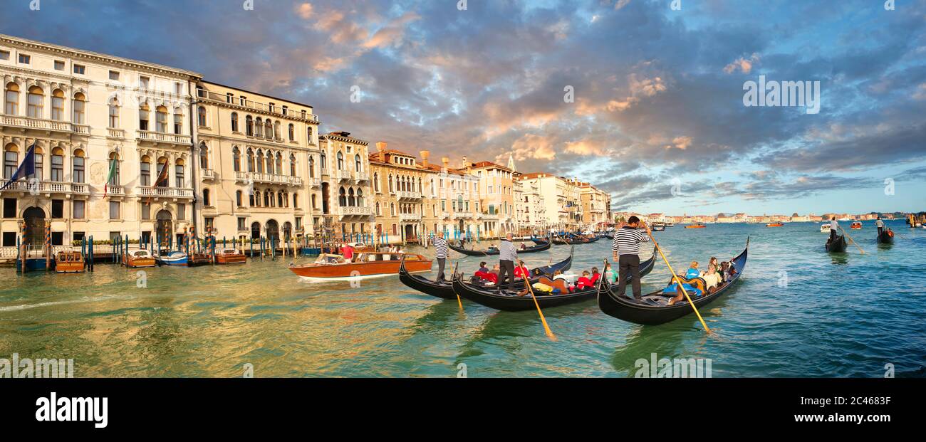 Venice gondola trip on the venetian grand canal at sunset Stock Photo