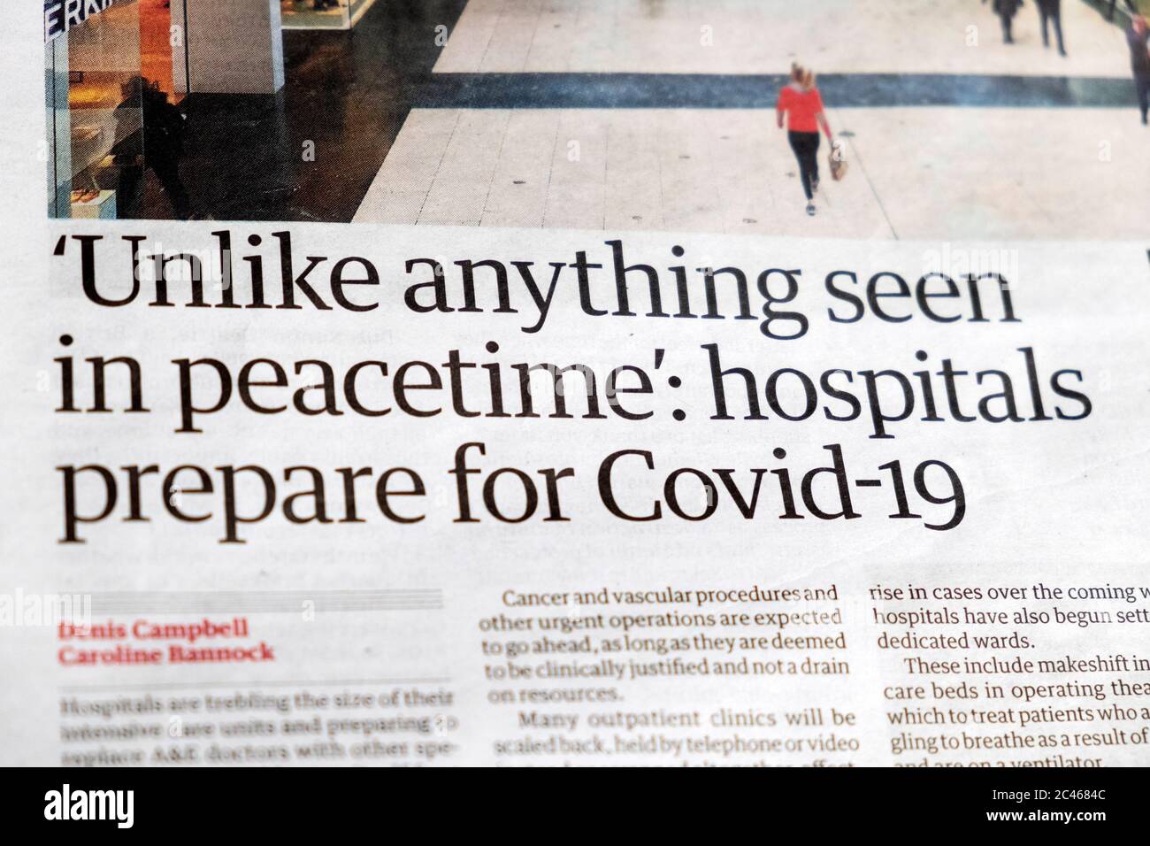 ' 'Unlike anything seen in peacetime': hospitals prepare for Covid-19' Guardian newspaper article 13 March 2020 London England UK Stock Photo