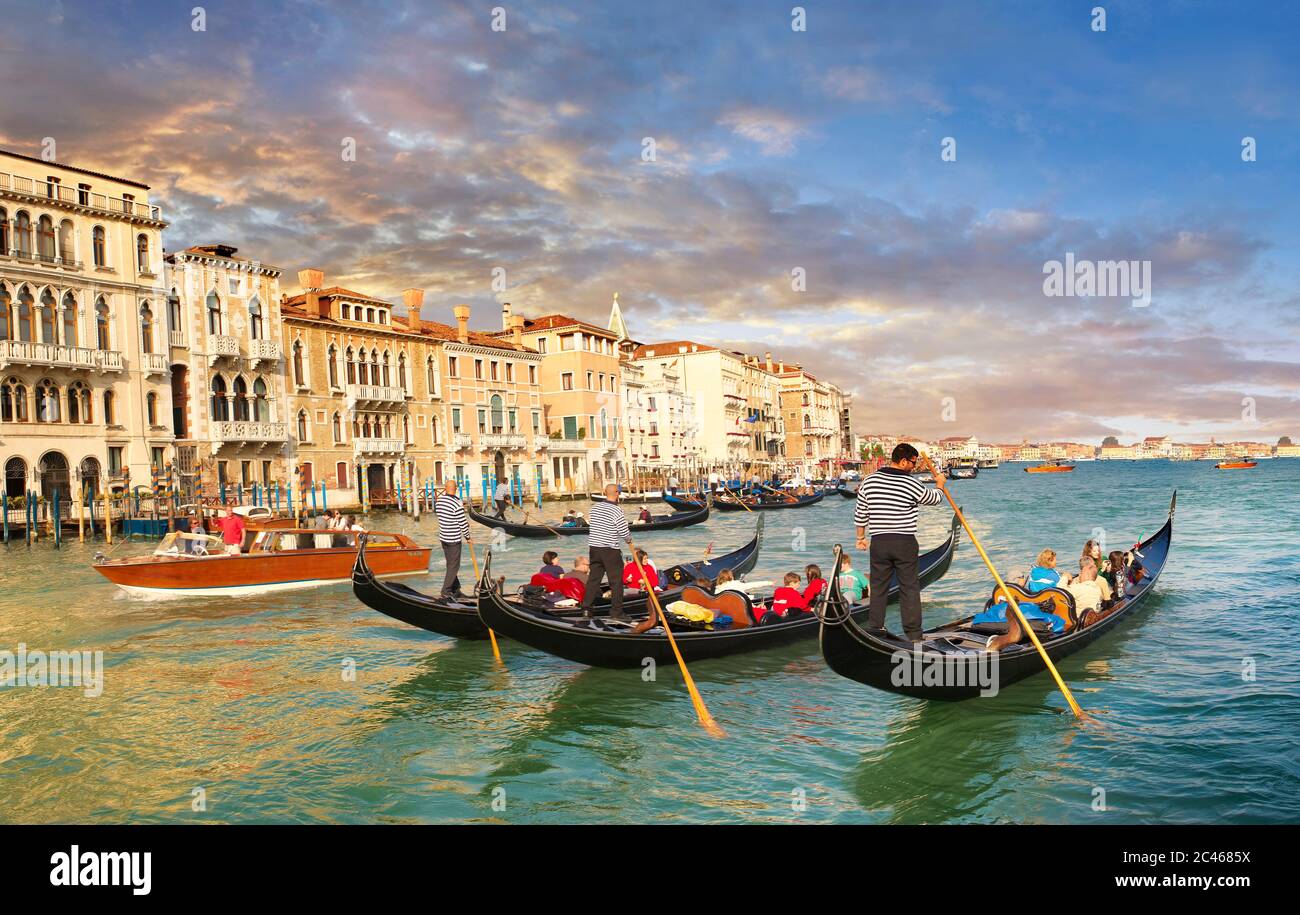 Venice gondola trip on the venetian grand canal at sunset Stock Photo