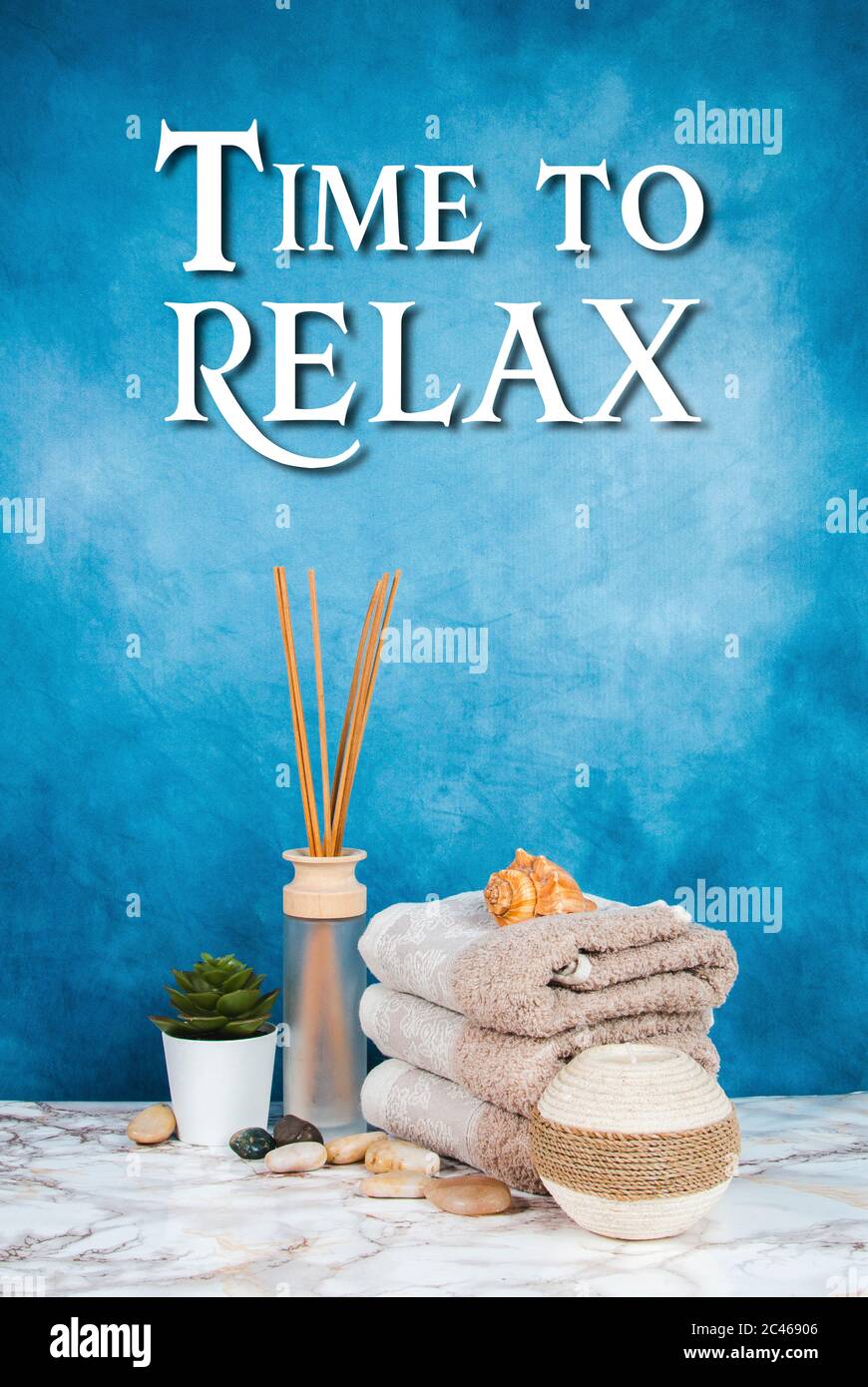 Spa objects and elements on a marble table and blue background Stock Photo