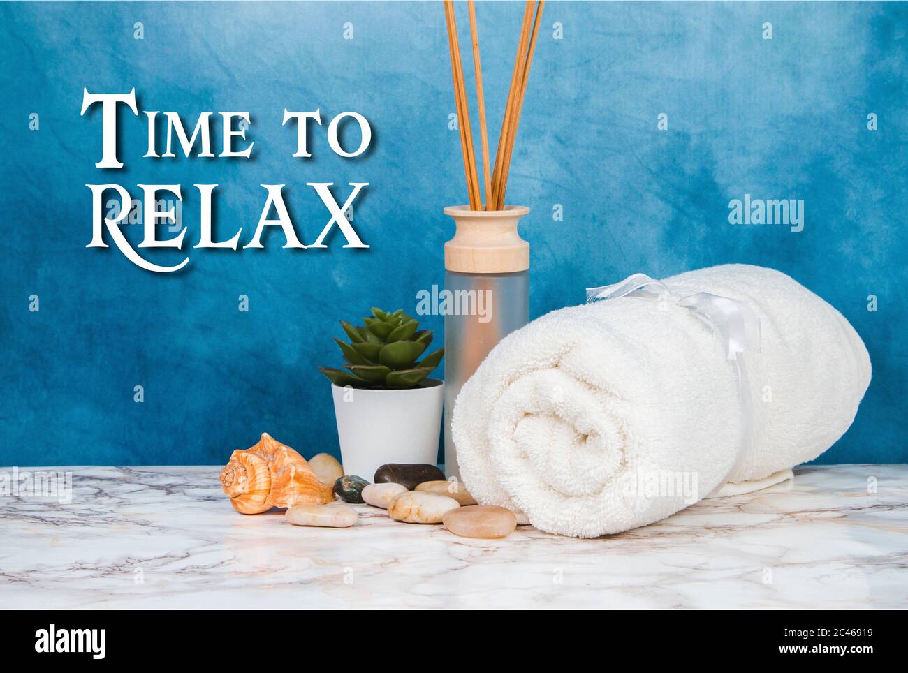 Spa objects and elements on a marble table and blue background Stock Photo