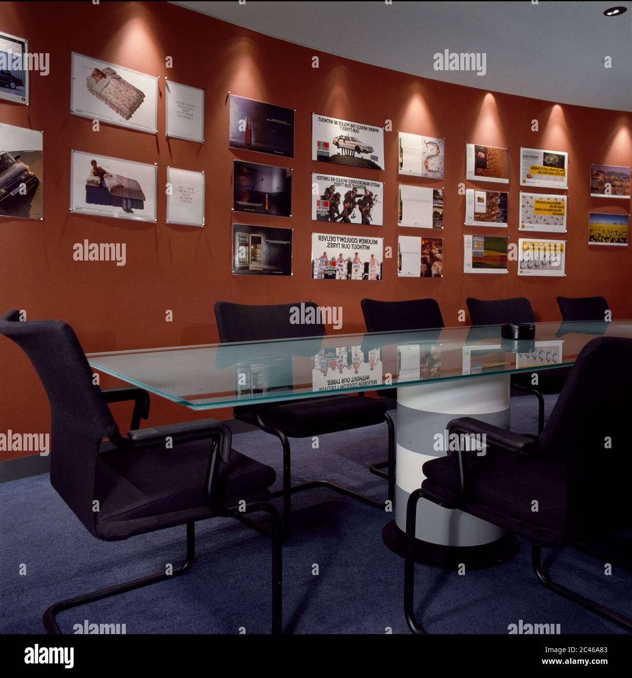 Glass boardroom table in modern room Stock Photo Alamy