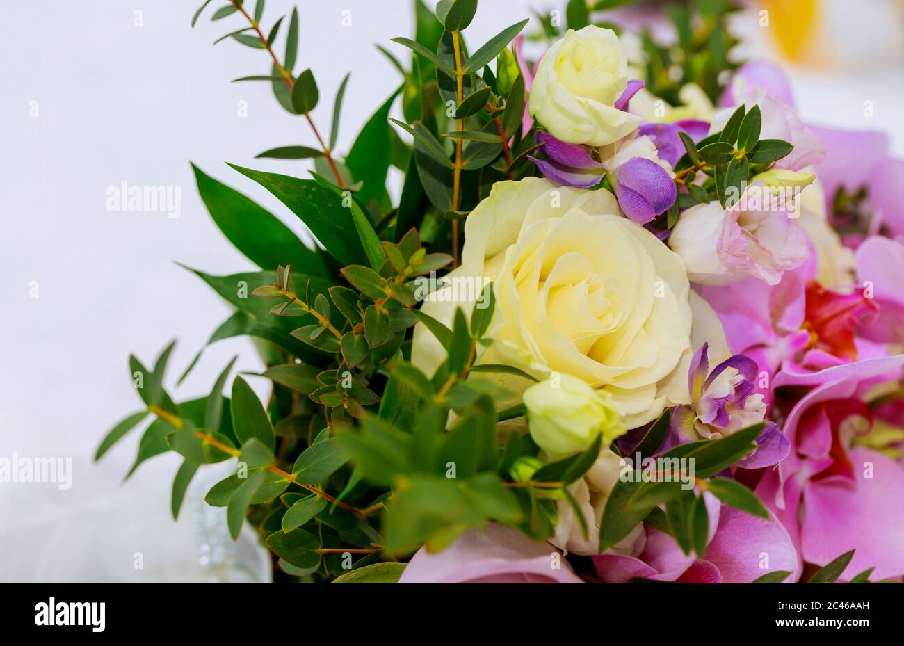 Bouquet from roses and iris isolated on white background. Stock Photo