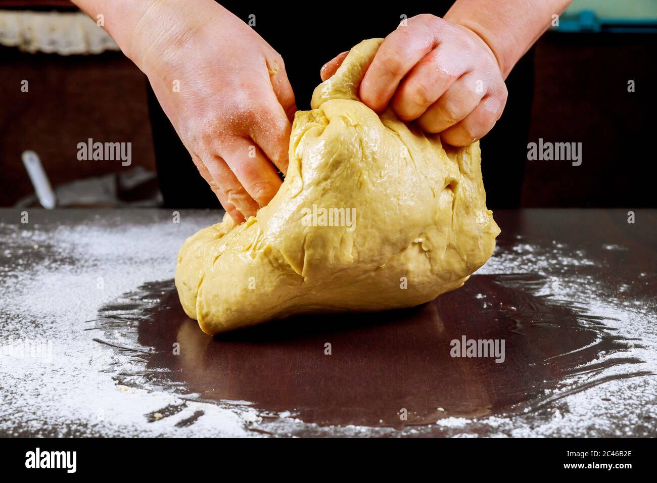 Raw pizza dough in chefs hands for making pizza Stock Photo Alamy