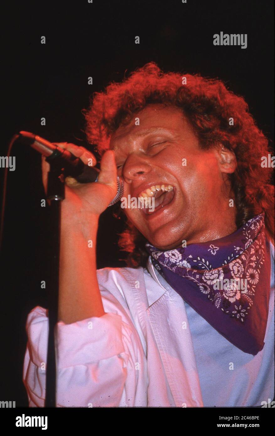 Foreigner on stage at Wembley Arena,London 1985: singer Lou Gramm Stock Photo