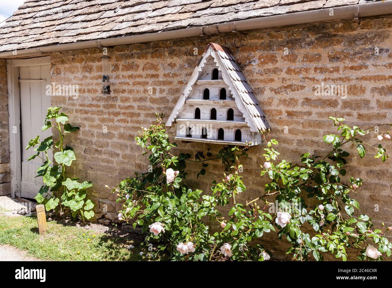A miniature dovecote in the Coln Valley in the Cotswold village of Winson, Gloucestershire UK Stock Photo