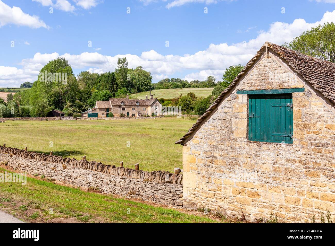 The Coln Valley - looking across to Yanworth Mill beside the River Coln near the Cotswold village of Yanworth, Gloucestershire UK Stock Photo