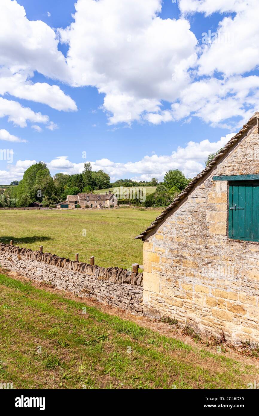 The Coln Valley - looking across to Yanworth Mill beside the River Coln near the Cotswold village of Yanworth, Gloucestershire UK Stock Photo