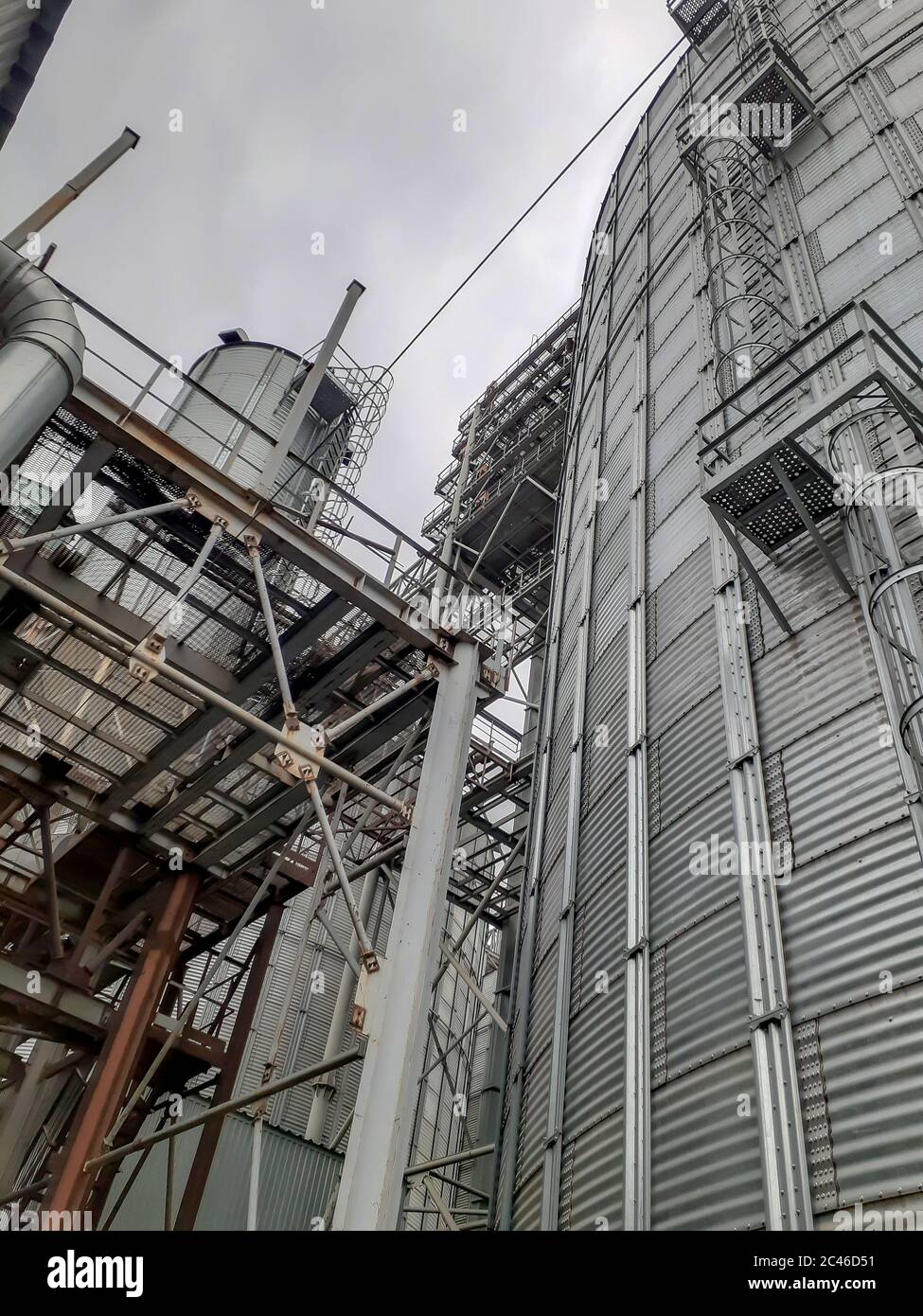 Metal structures of a modern grain elevator. Beams and trusses next to