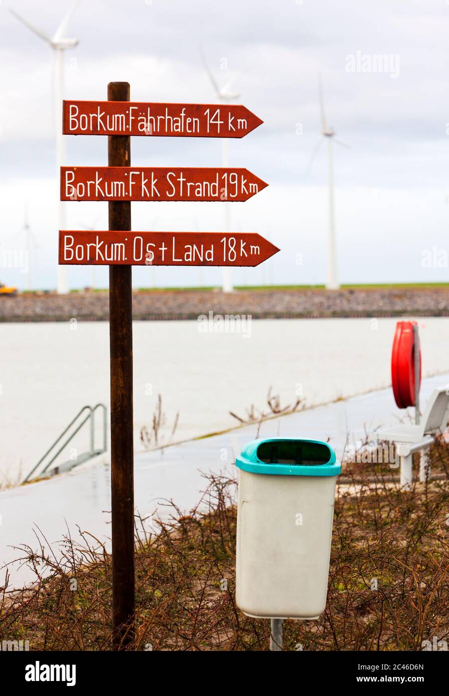 Signpost at Eemshaven ferry terminal with directional signs guiding to locations on the North Sea island of Borkum Stock Photo