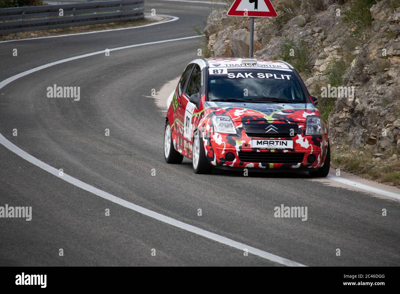 Skradin Croatia, June 2020 Racing Citroen C2 going uphill on a hillclimb,  painted in arctic tiger red white camo Stock Photo - Alamy