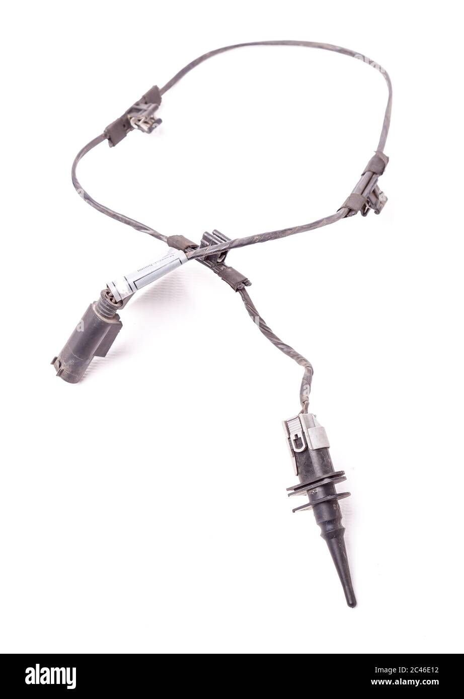 Air temperature sensor with a metal wire on a white background. Engine control unit for sale or