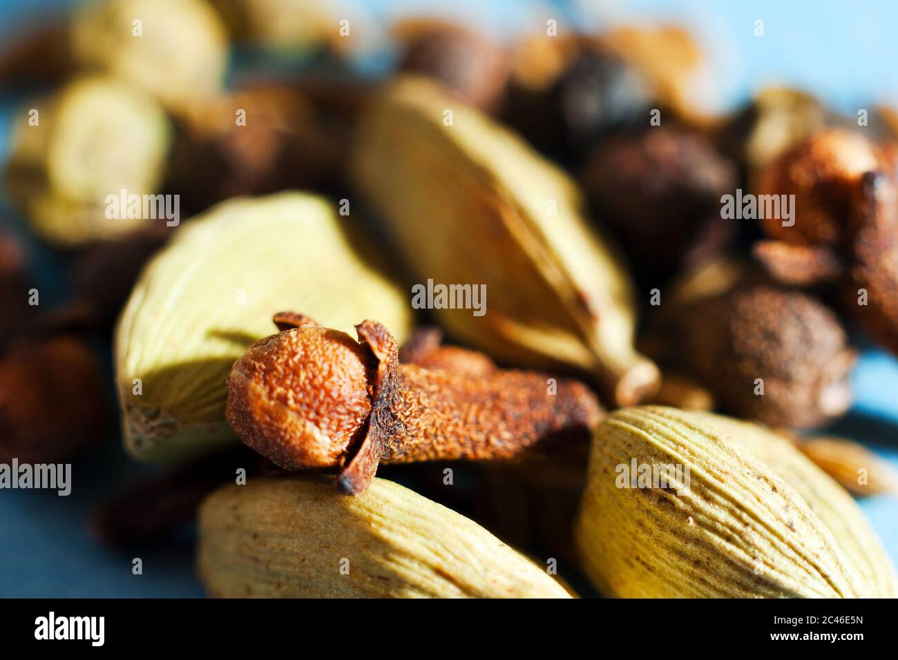 Spices macro of cardamoms and cloves Stock Photo